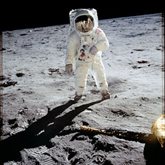 Astronaut Buzz Aldrin walks on the moon.