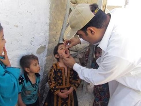 Child receiving oral polio vaccine