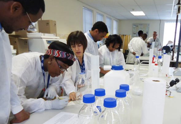 Laboratory staff prepare reagents for HIV testing.